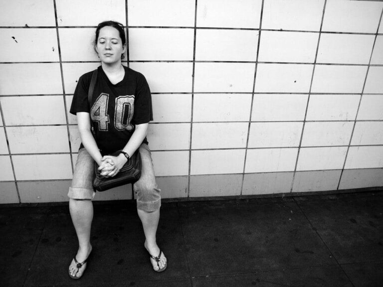 wall sits woman