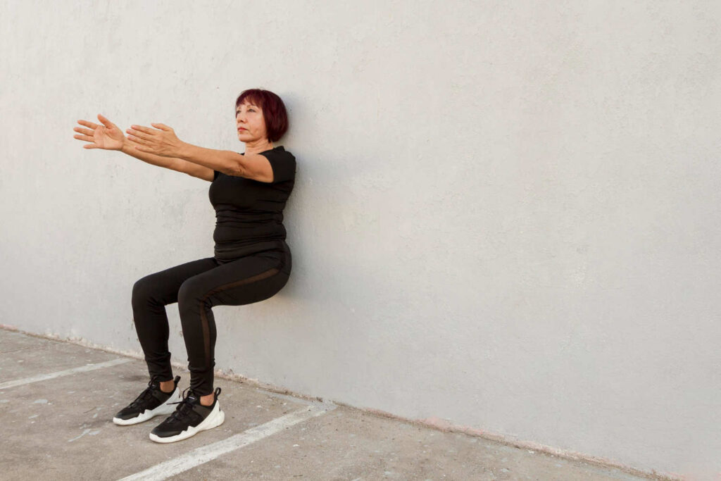 woman doing wall sits