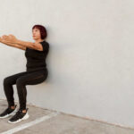 woman doing wall sits